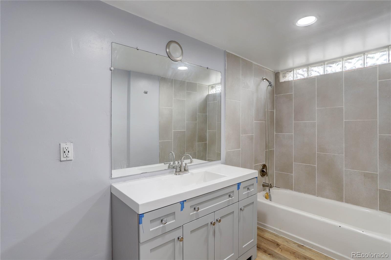 4315 Balsam Street Wheat Ridge, CO 80033 - Photo 22 of 34 a bathroom with a sink a toilet and shower