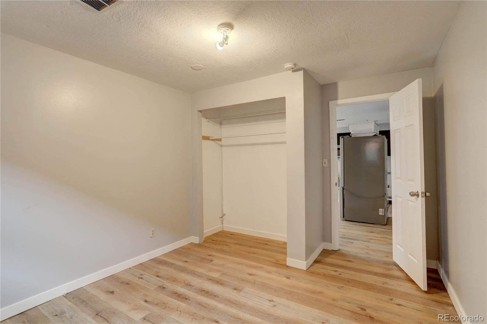 4315 Balsam Street Wheat Ridge, CO 80033 - Photo 25 of 34 wooden floor in an empty room