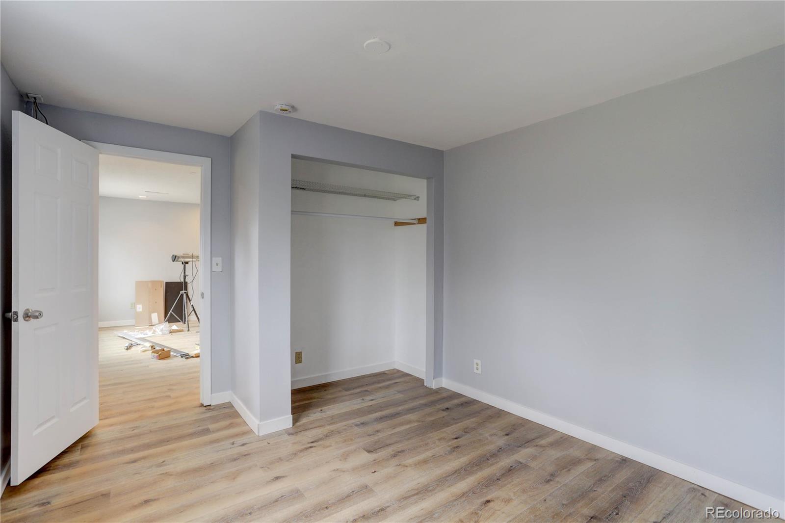 4315 Balsam Street Wheat Ridge, CO 80033 - Photo 26 of 34 a view of a hallway with wooden floor