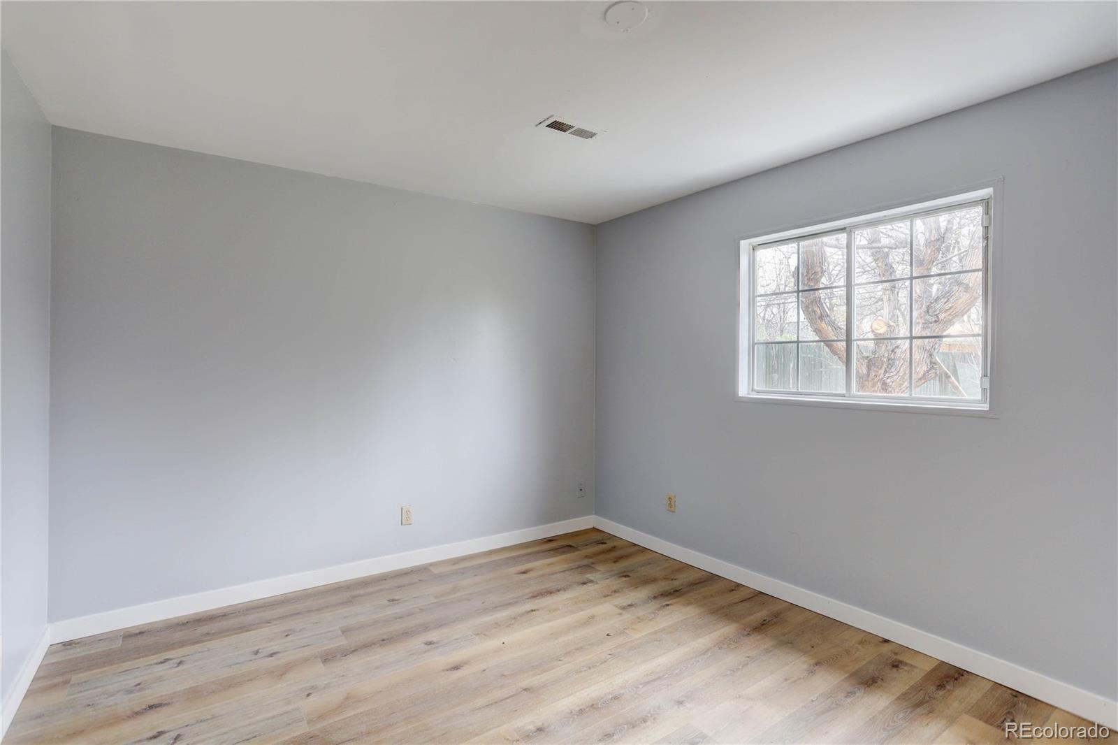 4315 Balsam Street Wheat Ridge, CO 80033 - Photo 28 of 34 a view of empty room with wooden floor