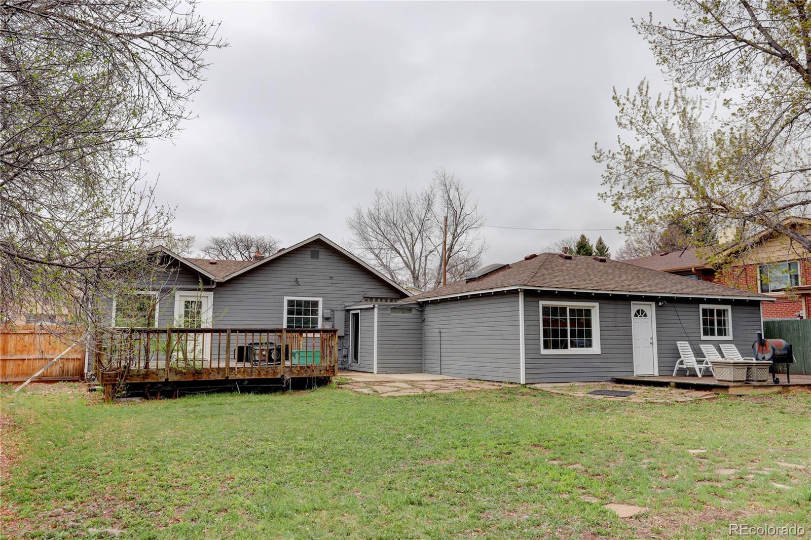 4315 Balsam Street Wheat Ridge, CO 80033 - Photo 29 of 34 a front view of a house with a yard and garage