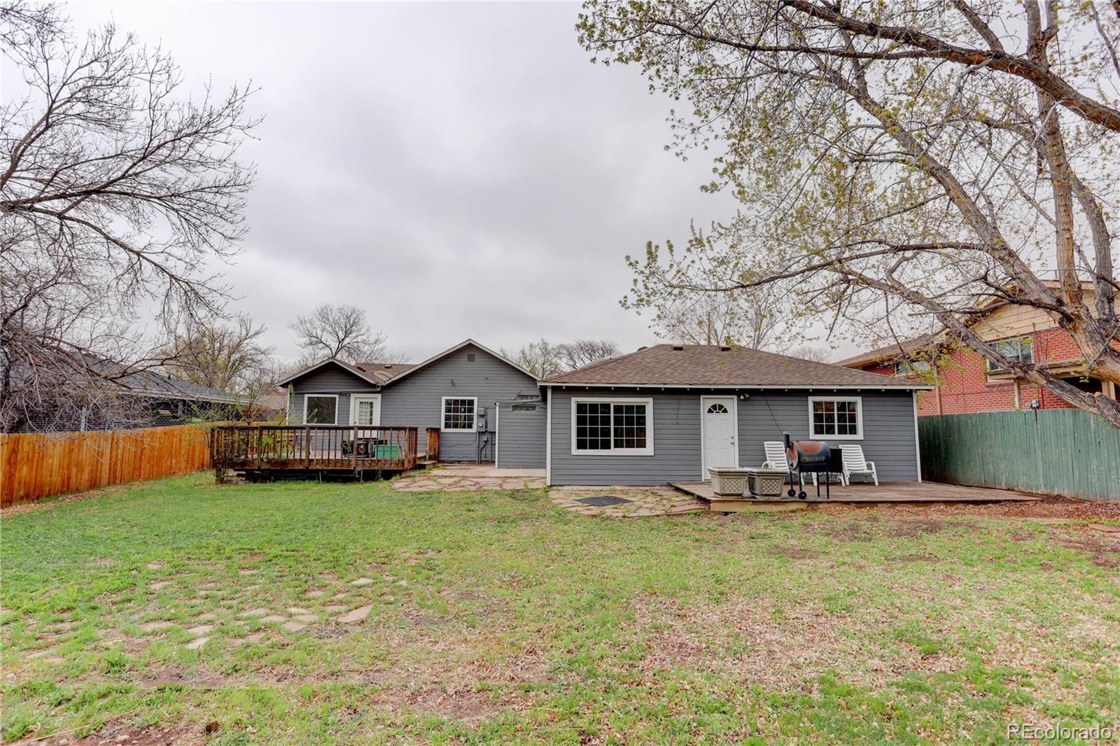 4315 Balsam Street Wheat Ridge, CO 80033 - Photo 31 of 34 a front view of a house with garden
