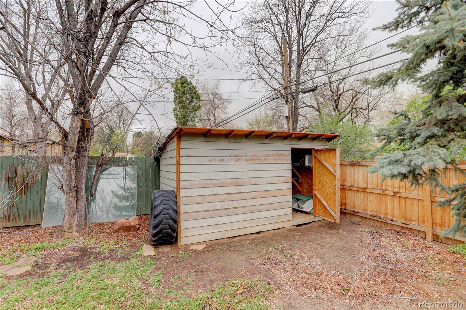 4315 Balsam Street Wheat Ridge, CO 80033 - Photo 32 of 34 a view of a house with a yard