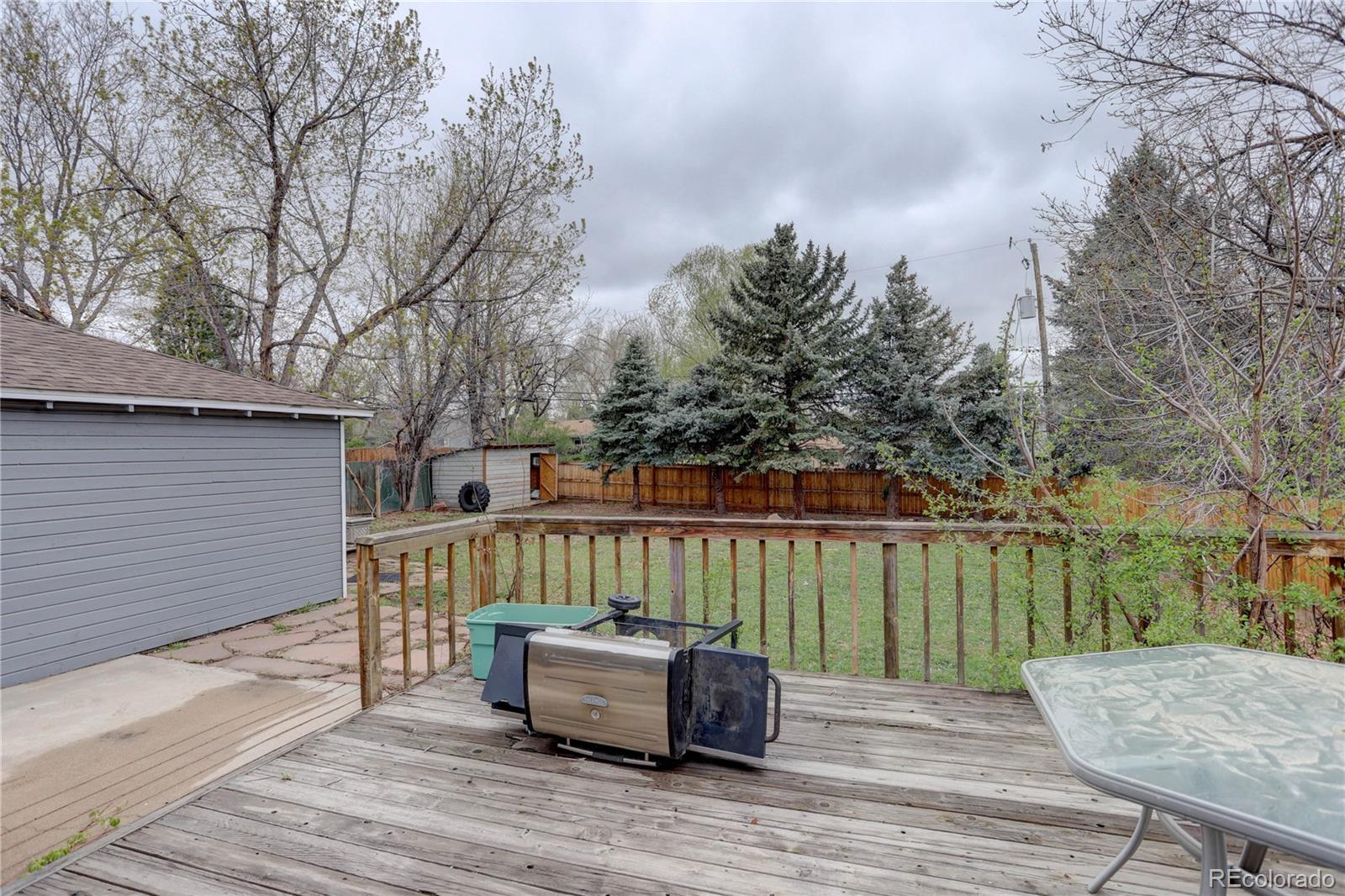 4315 Balsam Street Wheat Ridge, CO 80033 - Photo 33 of 34 a view of a wooden deck with furniture