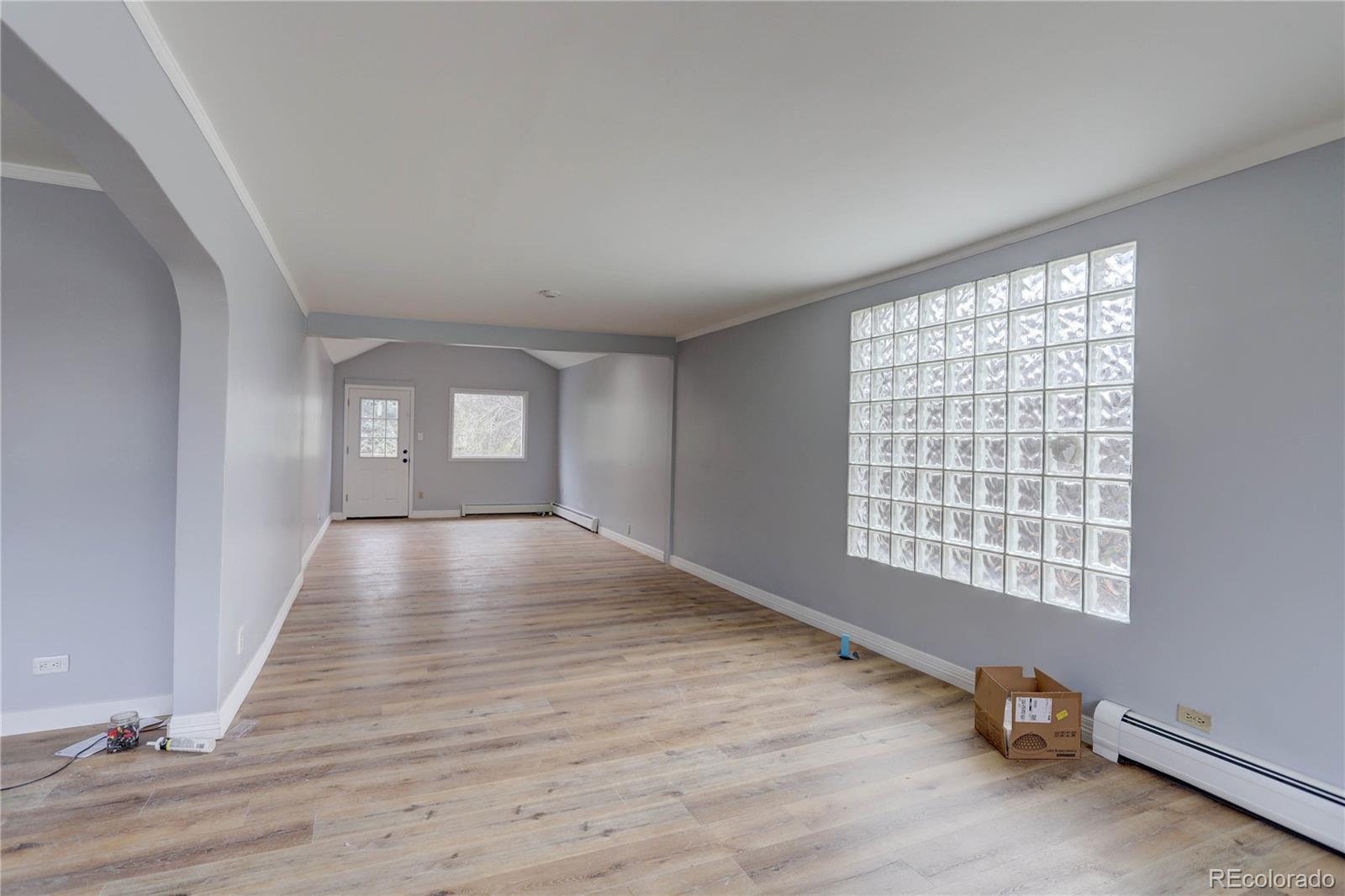 4315 Balsam Street Wheat Ridge, CO 80033 - Photo 5 of 34 a view of empty room with wooden floor and fan
