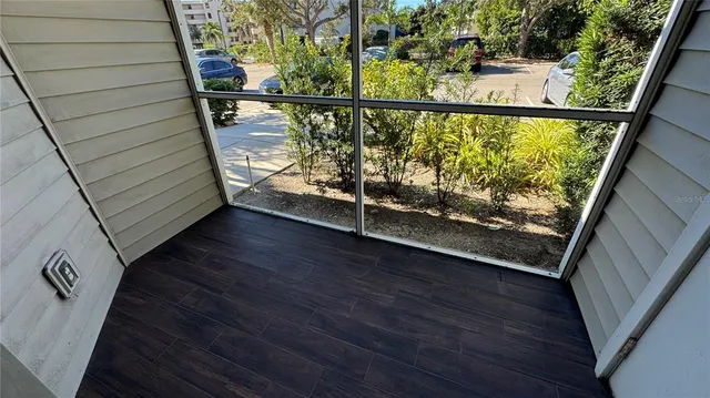 a view of a balcony with wooden floor
