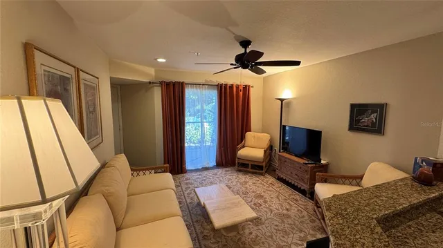 a bedroom with a bed furniture and a flat screen tv