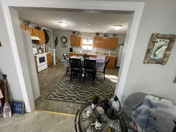 a bedroom with two beds and a flat screen tv
