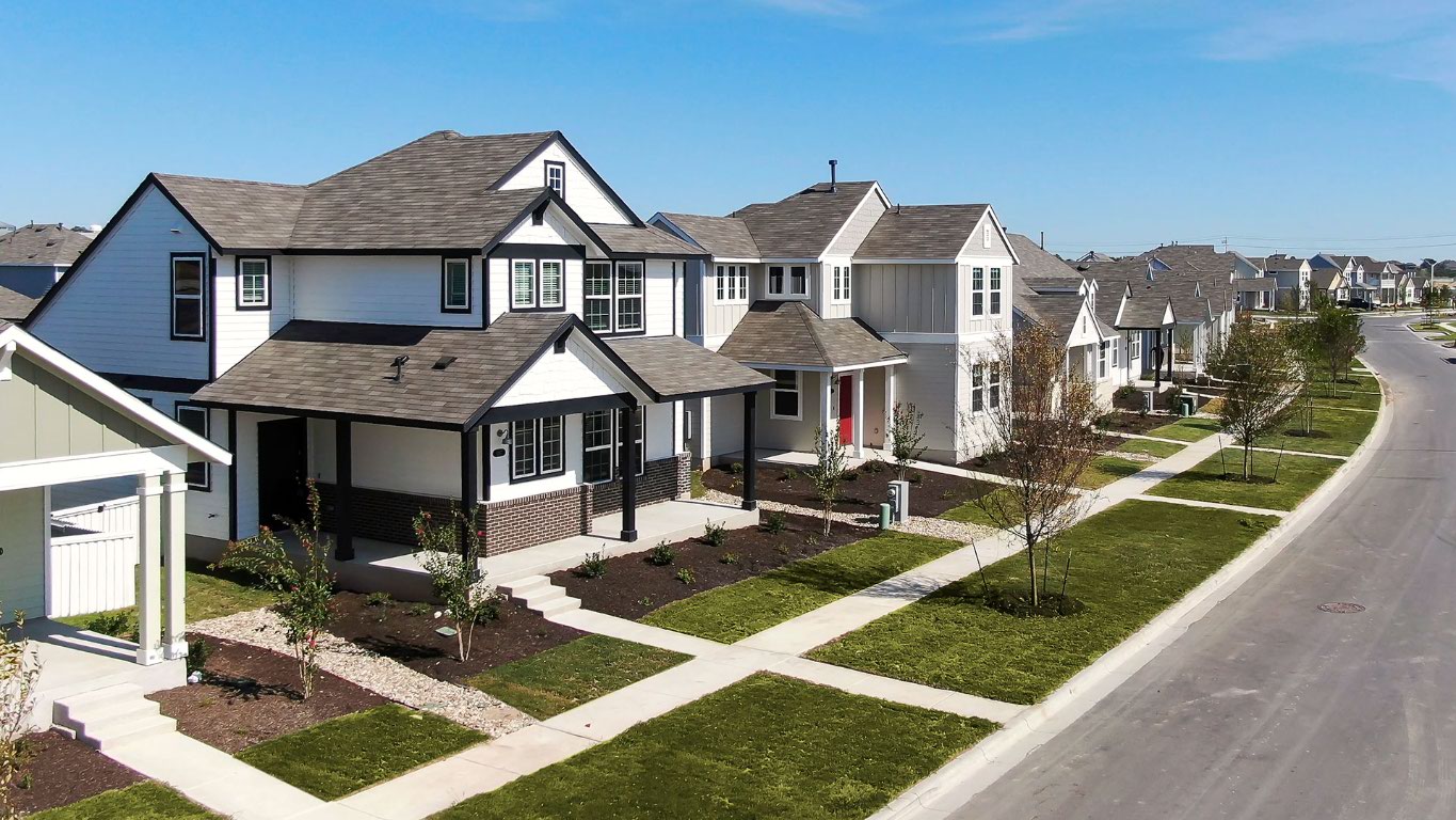 140 Backwater Road Kyle, TX 78640 - Photo 4 of 6 a front view of a house with garden