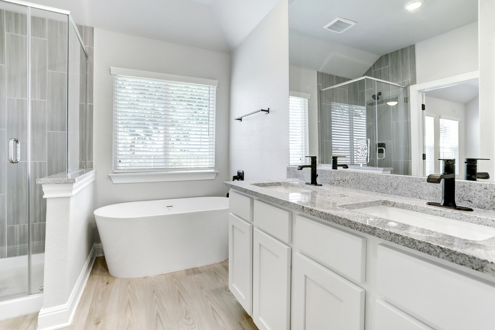 120 Periwinkle Lane Bastrop, TX 78602 - Photo 5 of 10 Spa-like soaking tub and separate shower in the primary bathroom