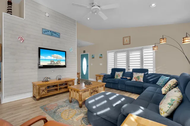 a bedroom with 2 bed and a painting on the wall