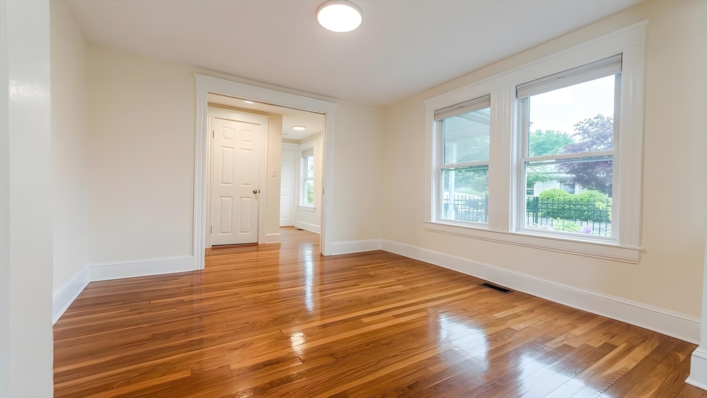 114 Curve Street Dedham, MA 02026 - Photo 21 of 27 a view of empty room with wooden floor and fan