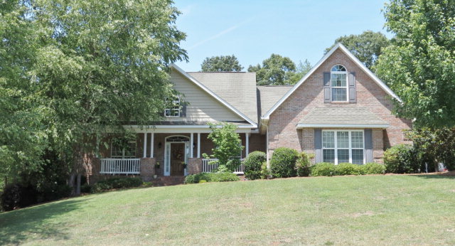 320 Eagle Ridge Road Macon, GA 31216 - Photo 1 of 35 a front view of a house with yard and green space