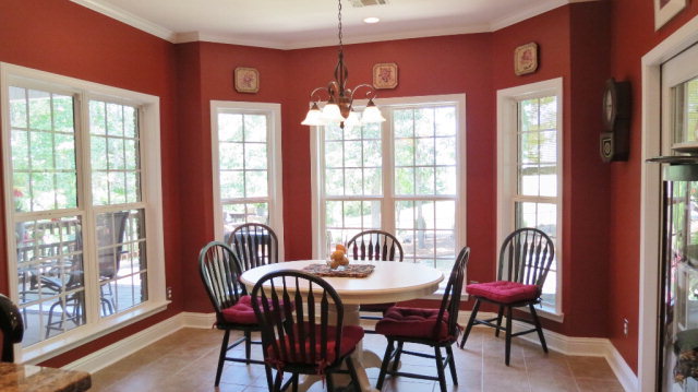 320 Eagle Ridge Road Macon, GA 31216 - Photo 13 of 35 a dining room with furniture a chandelier and wooden floor