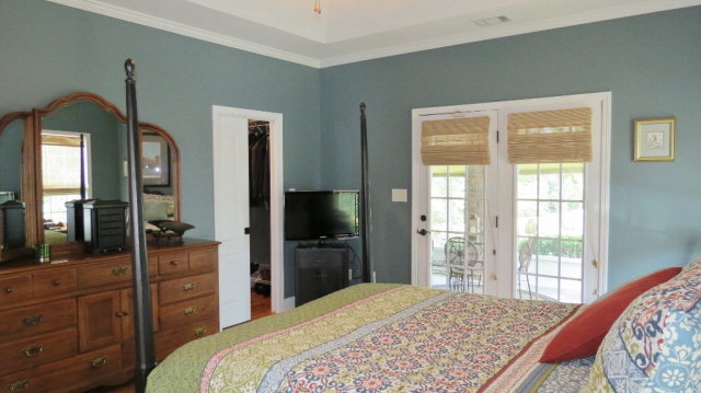 320 Eagle Ridge Road Macon, GA 31216 - Photo 19 of 35 a bedroom with a bed and a flat tv screen on dresser