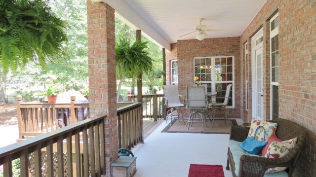 320 Eagle Ridge Road Macon, GA 31216 - Photo 27 of 35 a view of a patio with couches table and chairs and potted plants