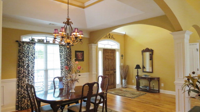 320 Eagle Ridge Road Macon, GA 31216 - Photo 5 of 35 a view of a dining room with furniture and chandelier