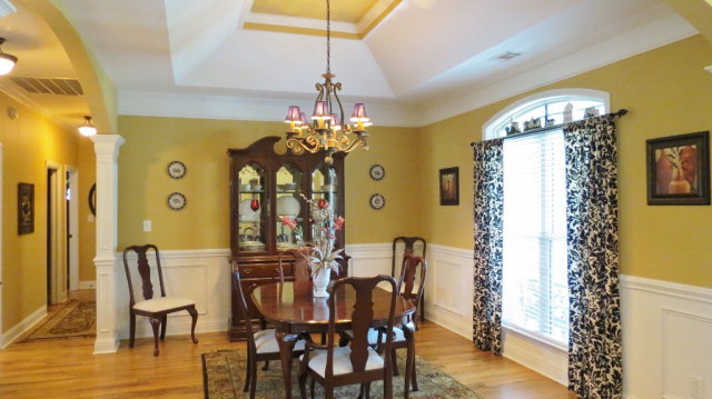 320 Eagle Ridge Road Macon, GA 31216 - Photo 7 of 35 a view of a dining room with furniture and chandelier