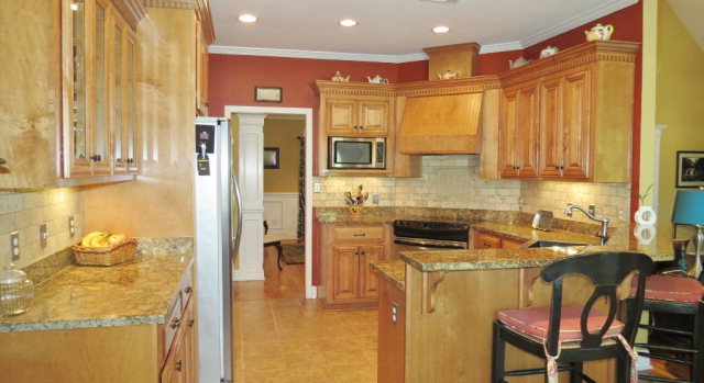 320 Eagle Ridge Road Macon, GA 31216 - Photo 10 of 35 a kitchen with stainless steel appliances granite countertop a refrigerator and a stove top oven