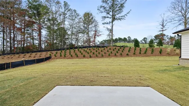 a kitchen with a sink cabinets and wooden floor