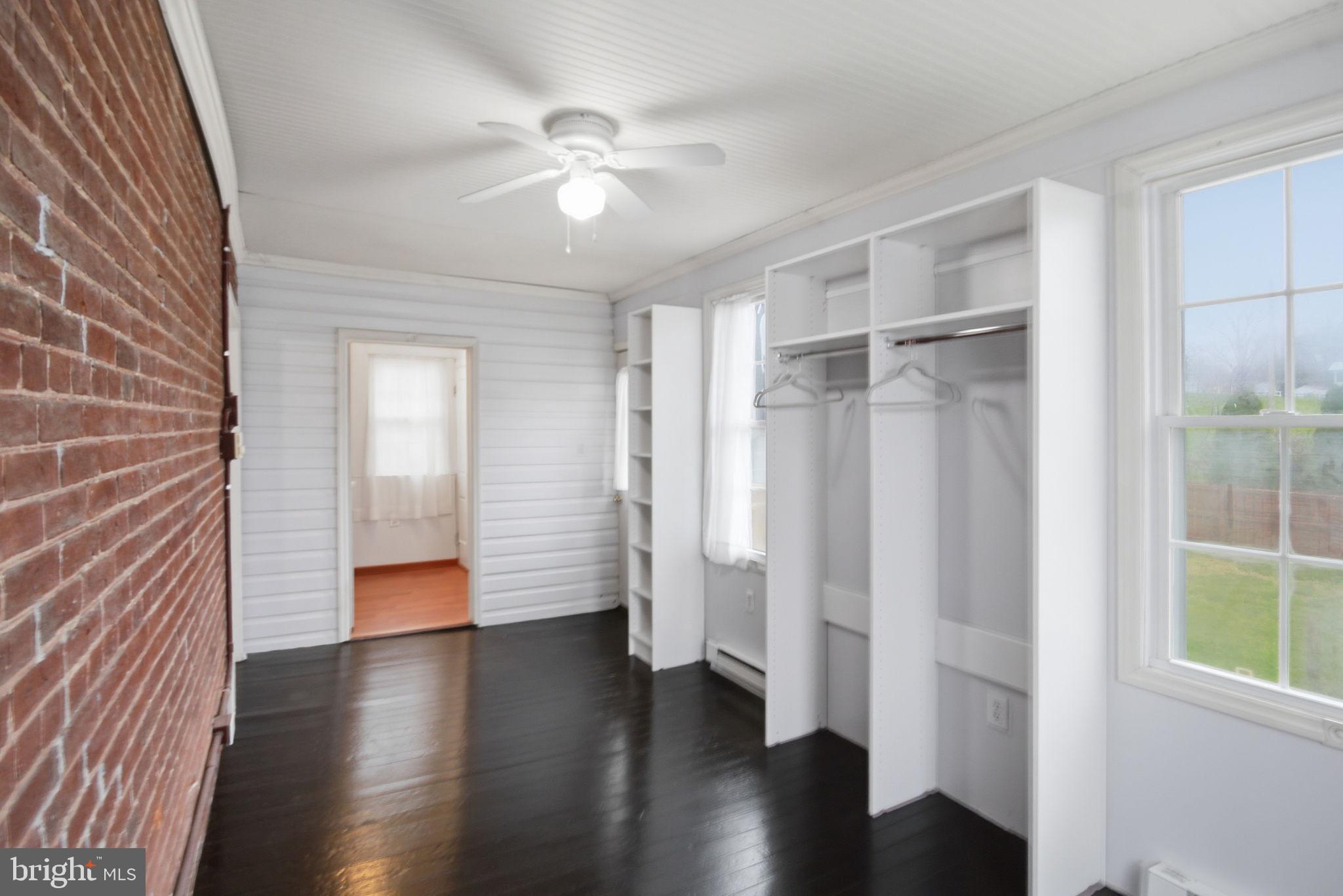 414 High Street New Windsor, MD 21776 - Photo 22 of 51 Doors to walk-in closet and deck, brick accent wal