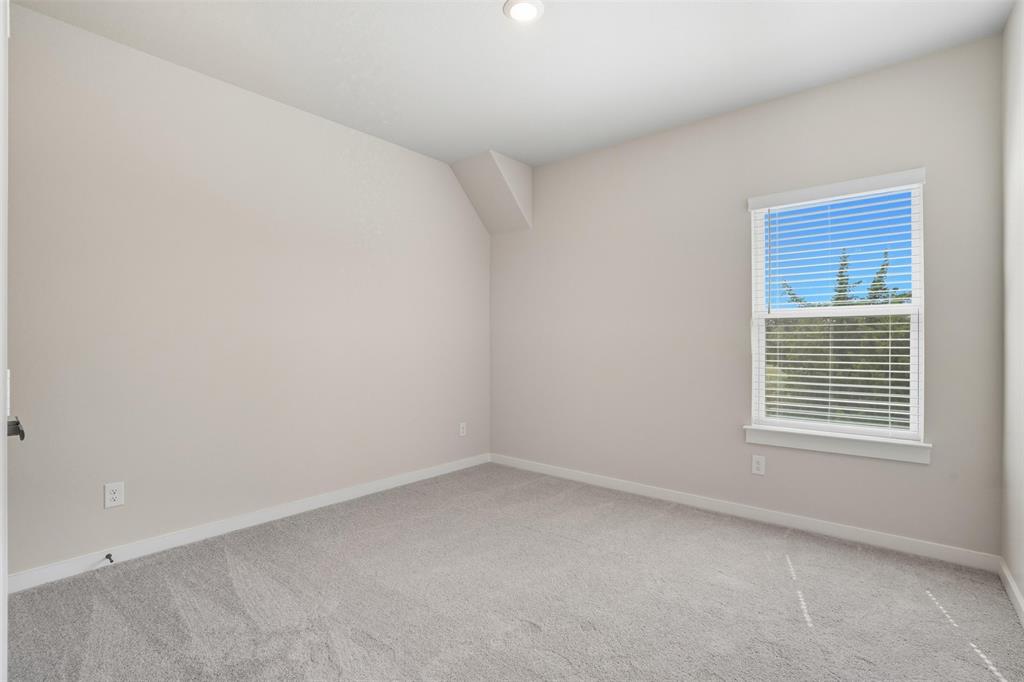 1606 Governors Boulevard Heath, TX 75126 - Photo 17 of 37 Unfurnished room with carpet flooring and baseboards