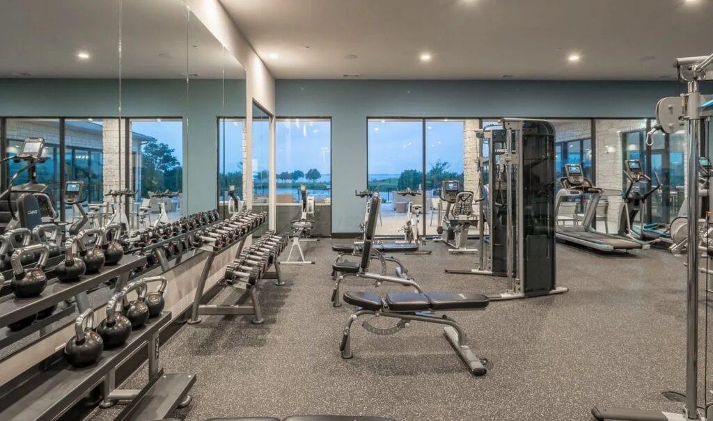 1606 Governors Boulevard Heath, TX 75126 - Photo 31 of 37 Exercise room with a water view and recessed lighting