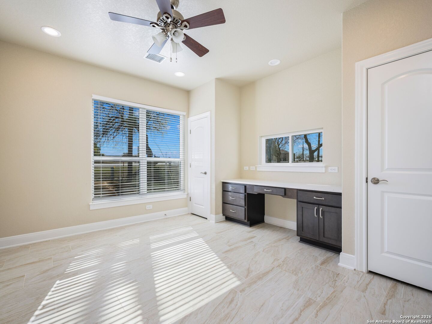 14681 Main Street Lytle, TX 78052 - Photo 23 of 33 a view of an empty room with a window and cabinet