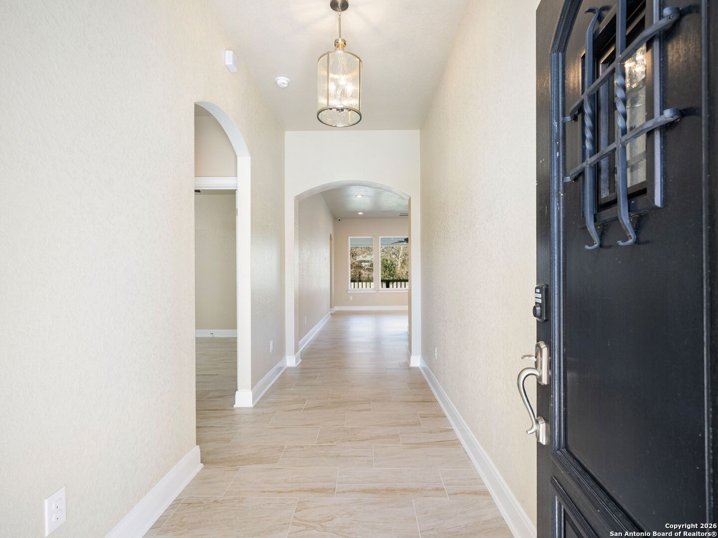 14681 Main Street Lytle, TX 78052 - Photo 3 of 33 a view of a hallway with wooden floor and staircase