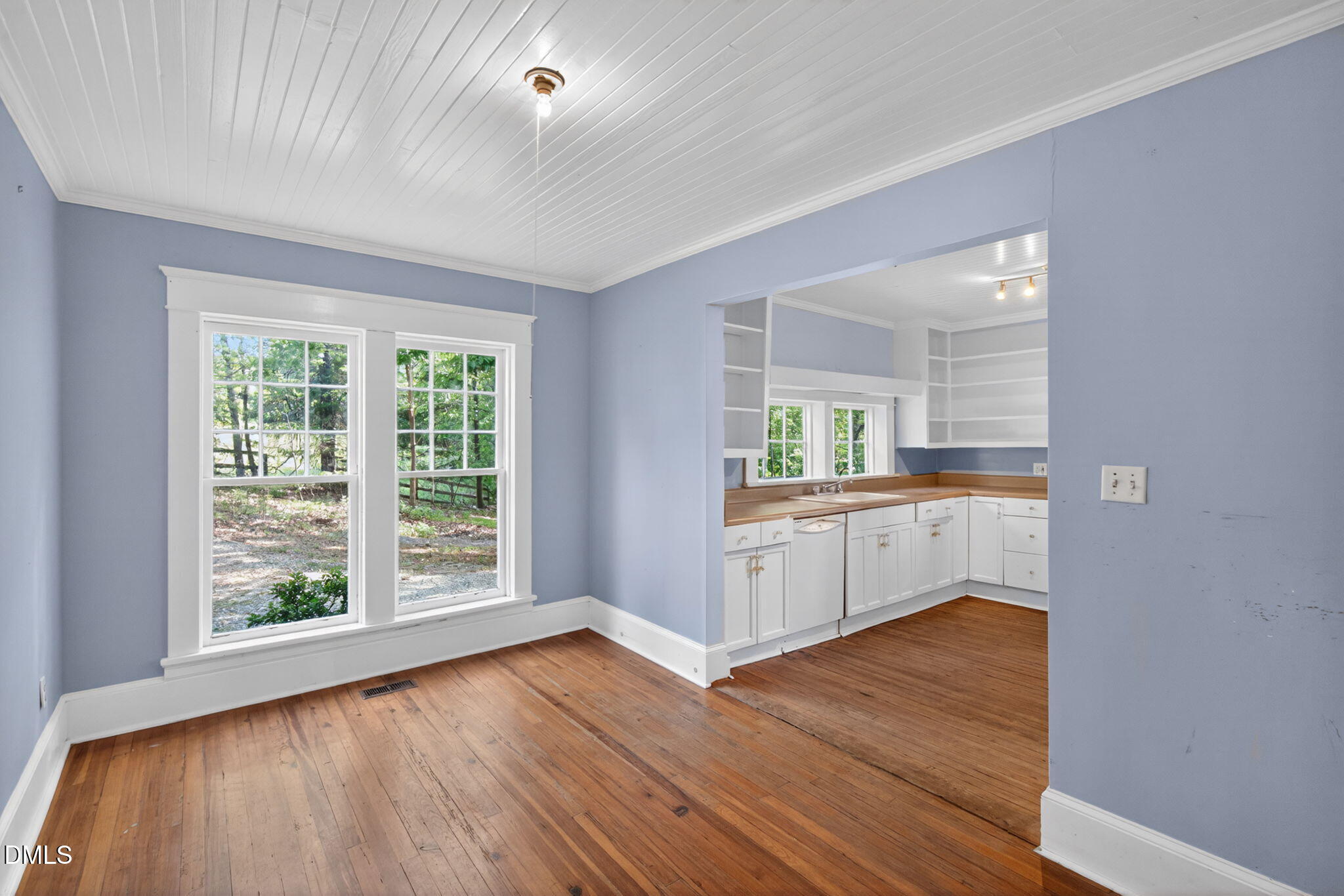 1714 Terry Road Durham, NC 27712 - Photo 10 of 39 wooden floor in an empty room with a window and wooden floor