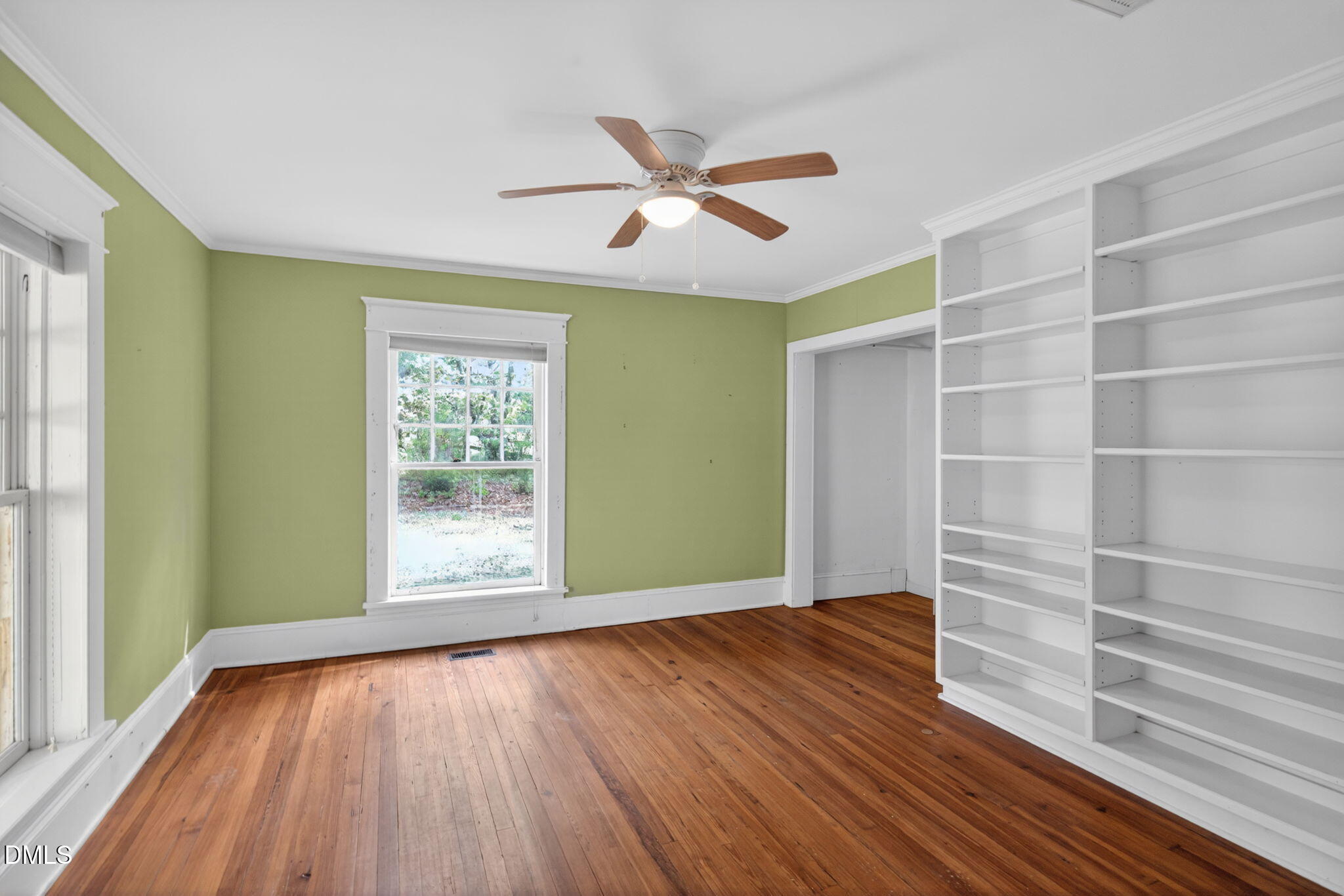 1714 Terry Road Durham, NC 27712 - Photo 14 of 39 a view of an empty room with a window and wooden floor