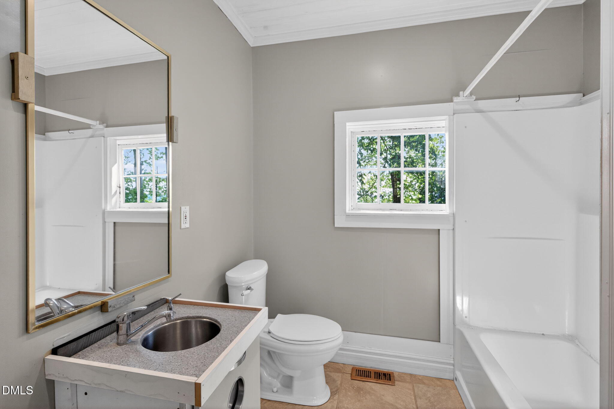 1714 Terry Road Durham, NC 27712 - Photo 18 of 39 a bathroom with a sink a toilet and a window