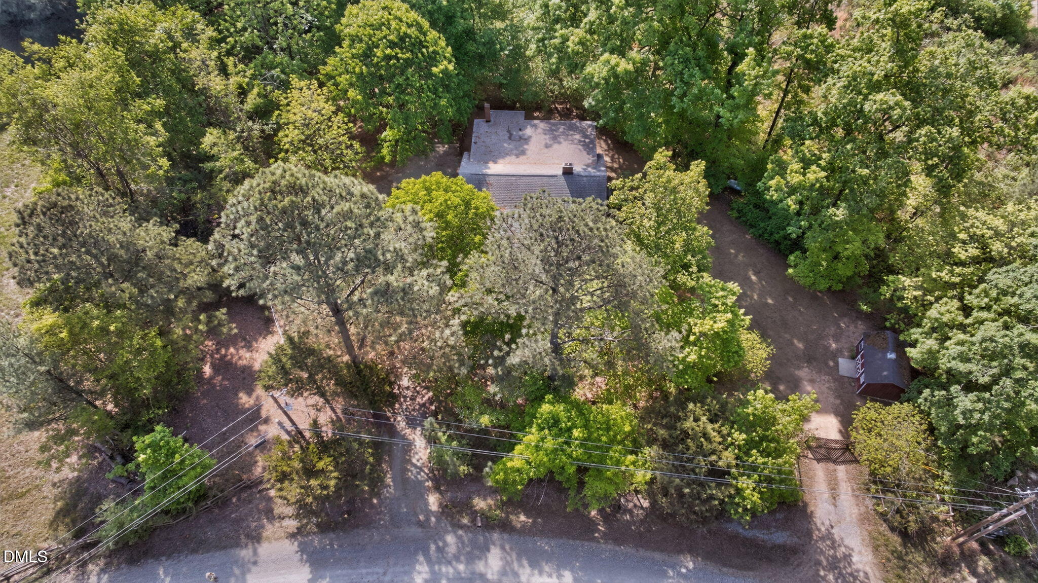 1714 Terry Road Durham, NC 27712 - Photo 26 of 39 an aerial view of a house with a yard and trees all around