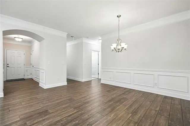 a view of kitchen with granite countertop cabinets and wooden floor