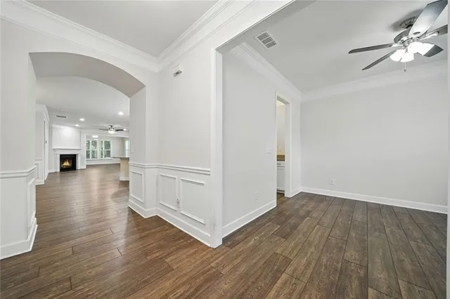 a kitchen with stainless steel appliances granite countertop a sink stove and wooden floor