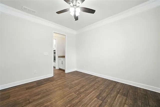 a kitchen with stainless steel appliances granite countertop a sink a stove and a wooden floors