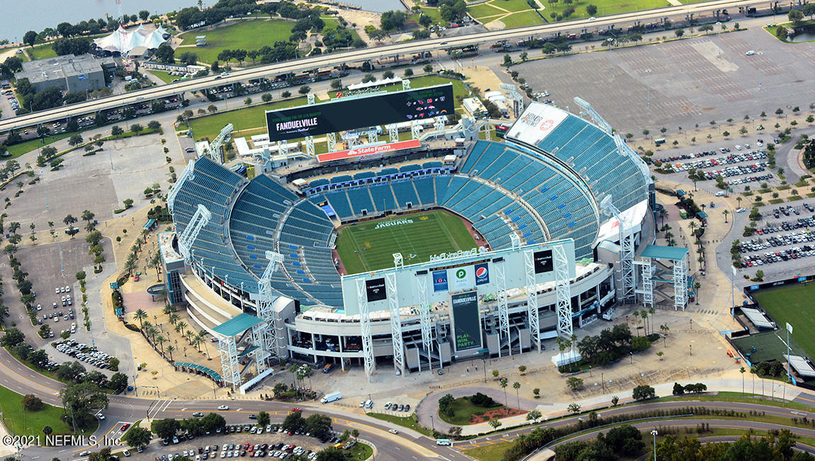 575 Oakleaf Plantation Parkway, Unit 208 Orange Park, FL 32065 - Photo 21 of 22 a aerial view of a house with a garden and outdoor seating
