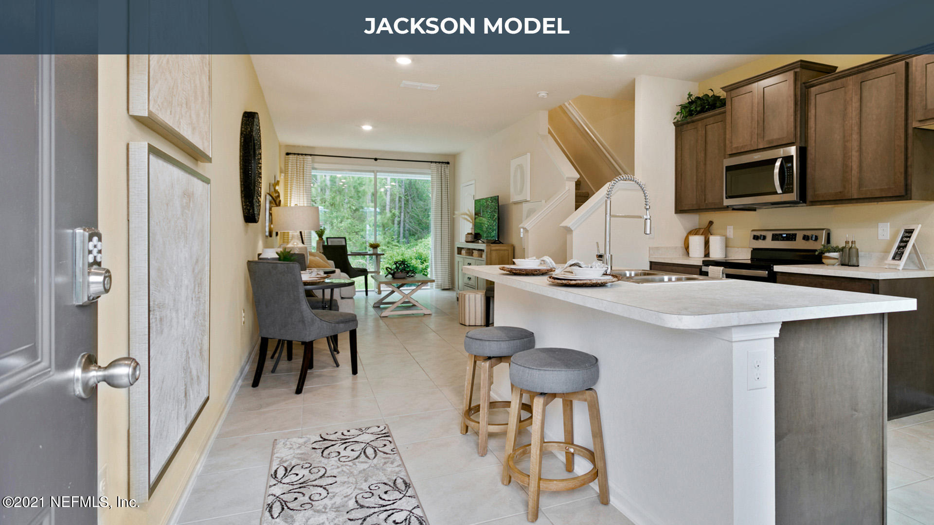 575 Oakleaf Plantation Parkway, Unit 208 Orange Park, FL 32065 - Photo 4 of 22 a kitchen with stainless steel appliances granite countertop a refrigerator and a sink