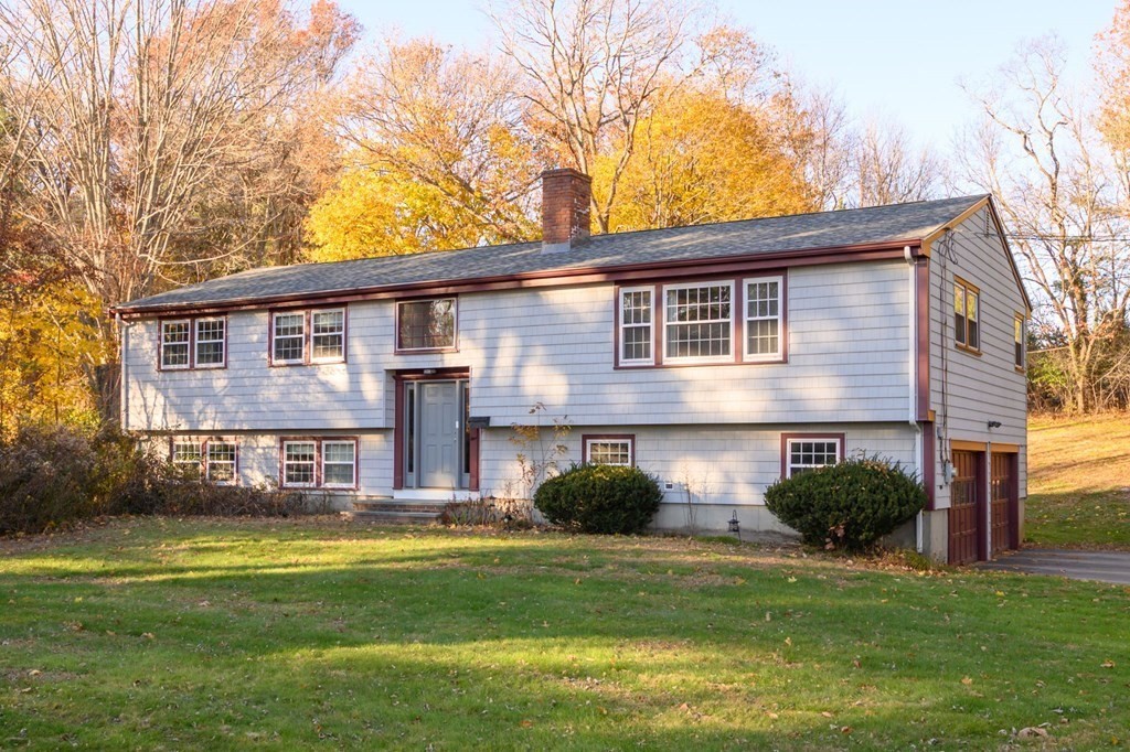 1 Pine Grove Road Hingham, MA 02043 - Photo 1 of 22 a front view of a house with a yard and garage
