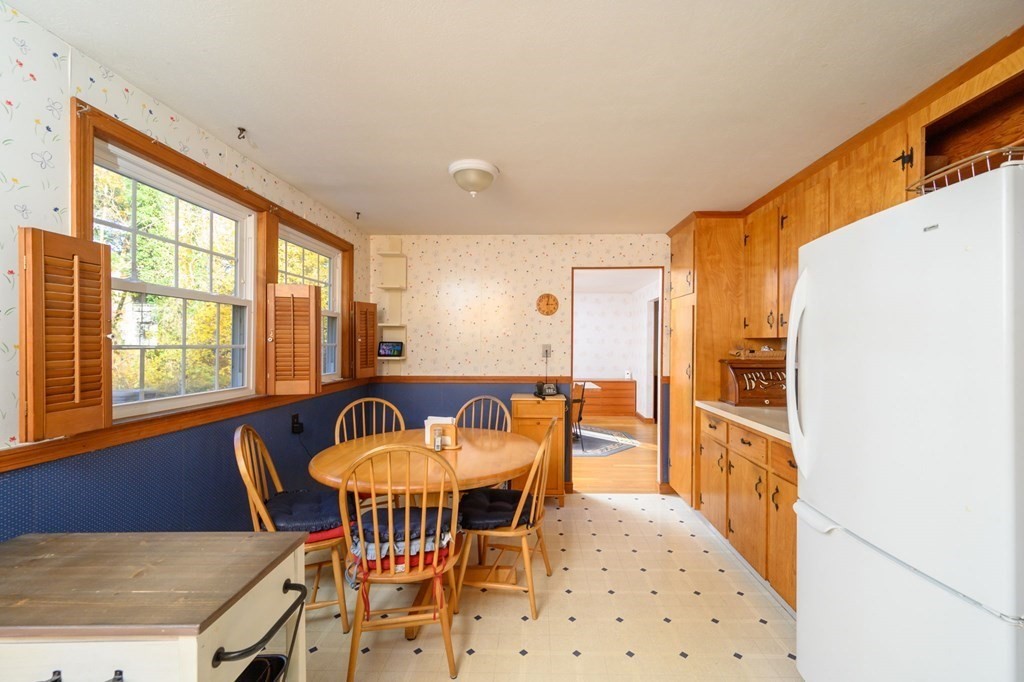 1 Pine Grove Road Hingham, MA 02043 - Photo 11 of 22 a view of a dining room with furniture and chandelier