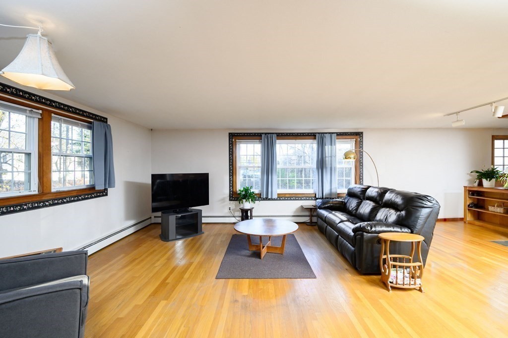 1 Pine Grove Road Hingham, MA 02043 - Photo 9 of 22 a living room with furniture and a flat screen tv