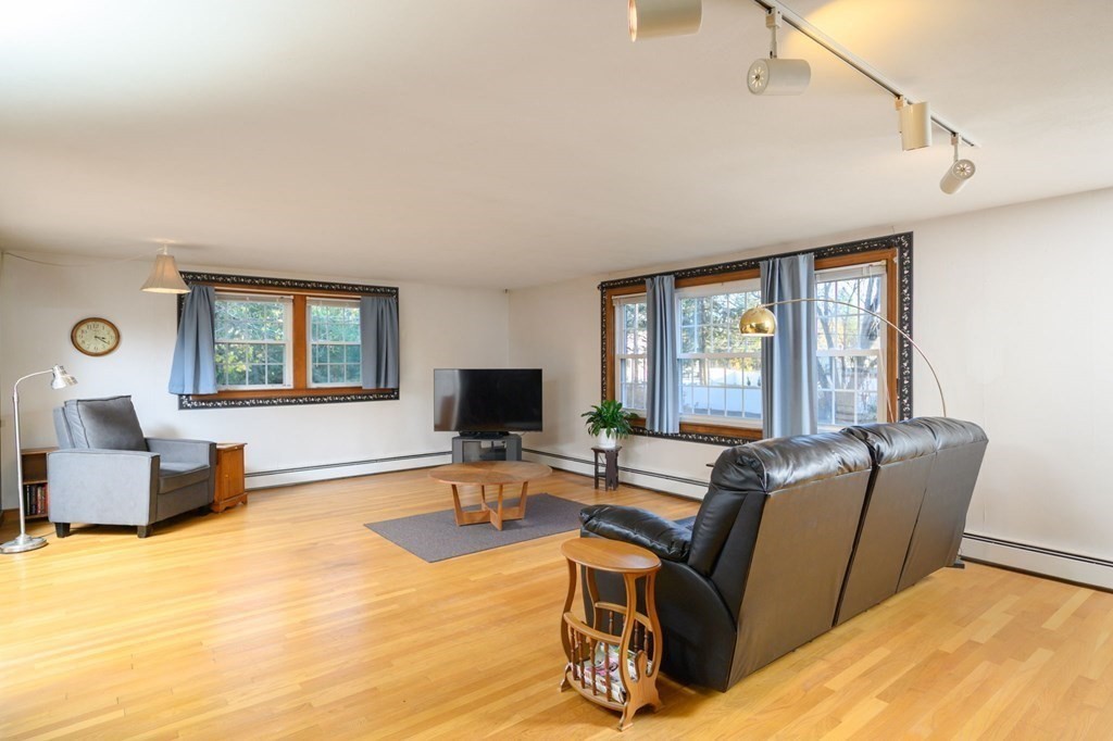 1 Pine Grove Road Hingham, MA 02043 - Photo 10 of 22 a living room with furniture window and a flat screen tv