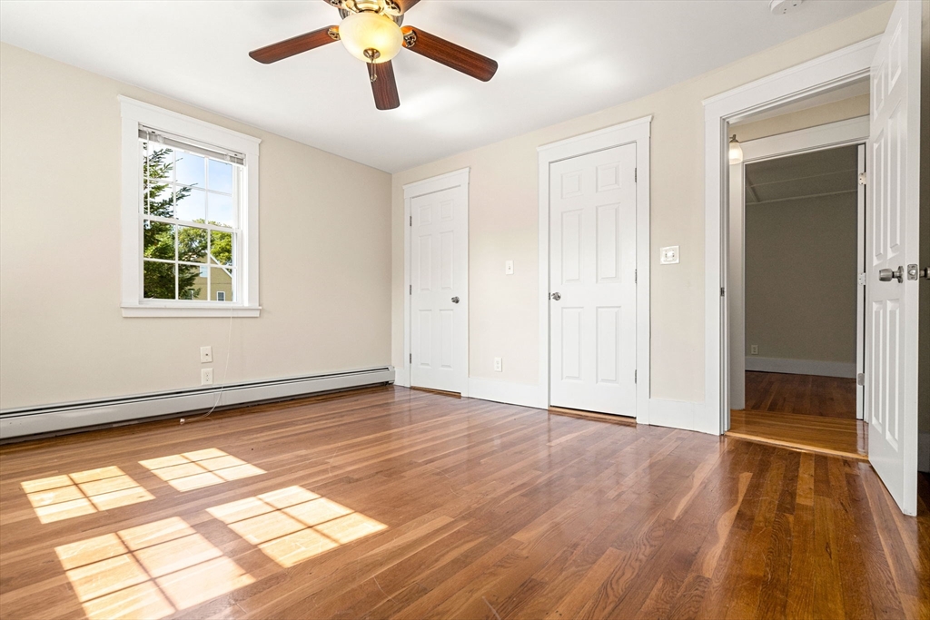 12 Chestnut Street Danvers, MA 01923 - Photo 26 of 37 a view of an empty room with wooden floor and a window
