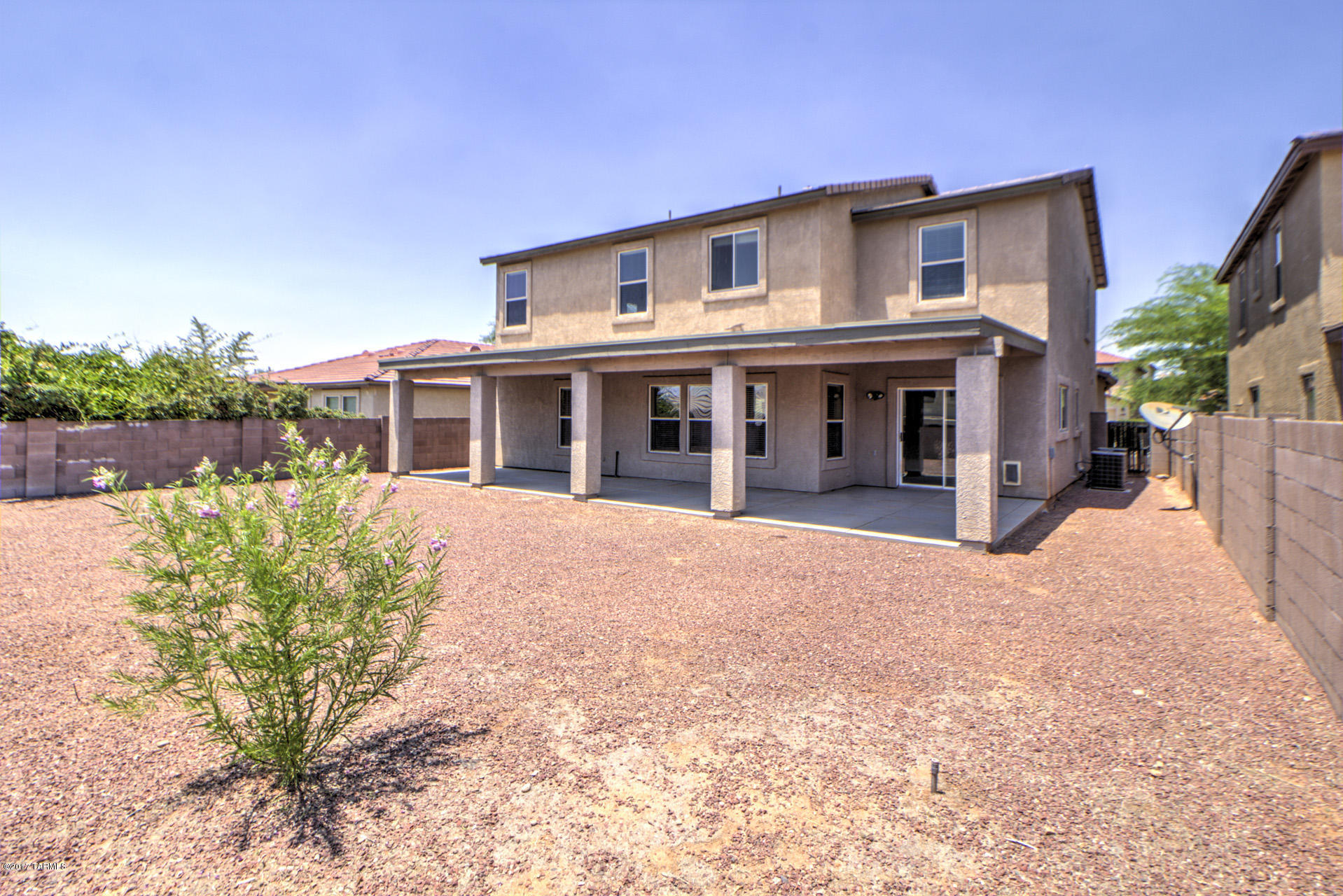 3588 East Mecate Road Tucson, AZ 85739 - Photo 31 of 36 front view of a house with a yard