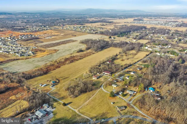an aerial view of residential building and ocean