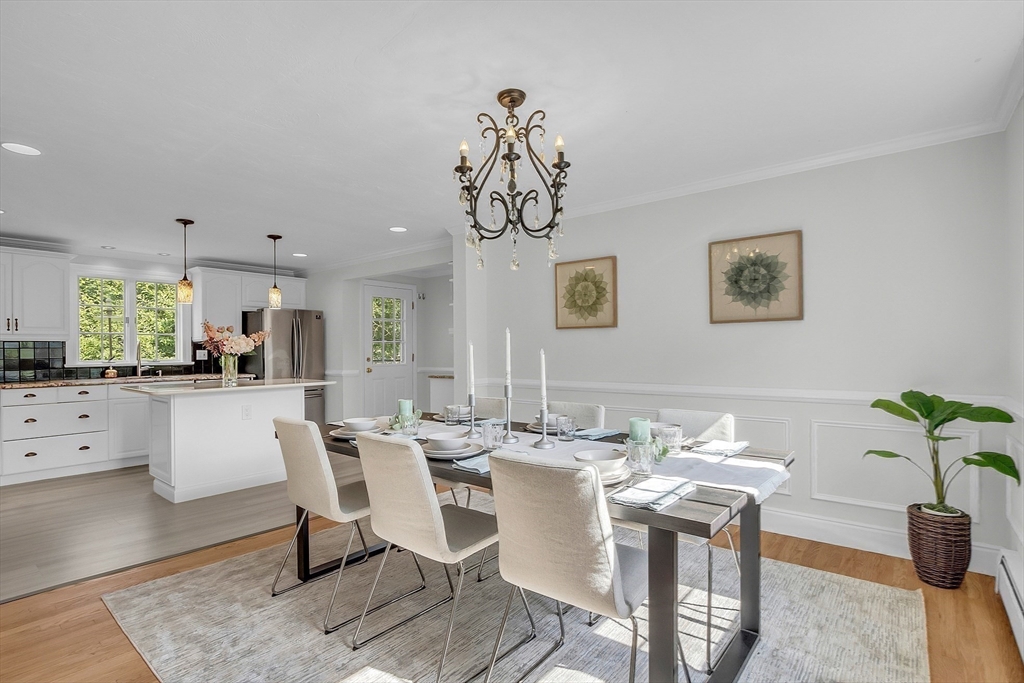 36 Flint Road Acton, MA 01720 - Photo 12 of 37 a view of a dining room with furniture window and wooden floor