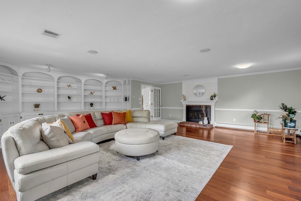 36 Flint Road Acton, MA 01720 - Photo 15 of 37 a living room with furniture and a fireplace