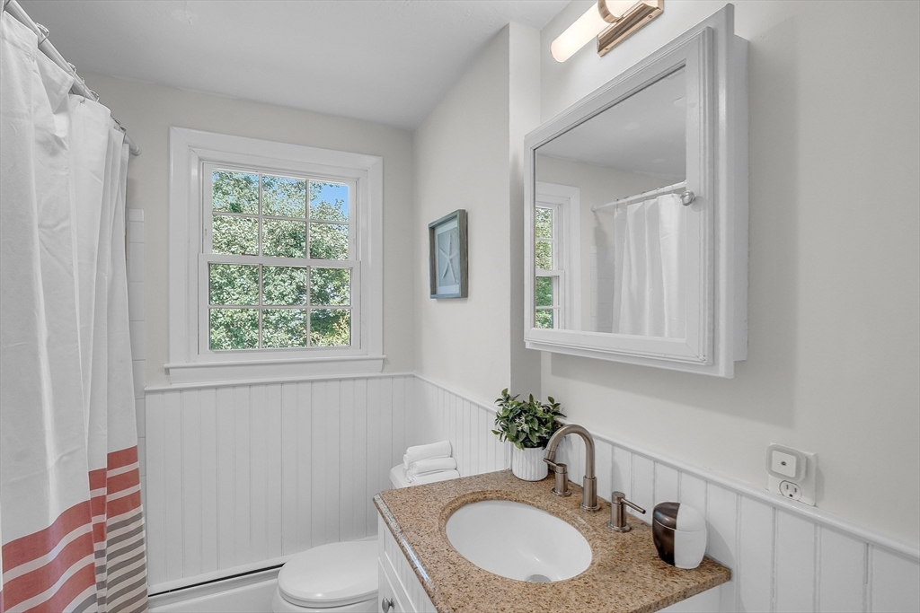 36 Flint Road Acton, MA 01720 - Photo 25 of 37 a bathroom with a granite countertop sink vanity mirror and toilet