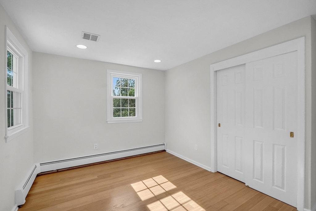 36 Flint Road Acton, MA 01720 - Photo 28 of 37 a view of empty room with wooden floor and fan