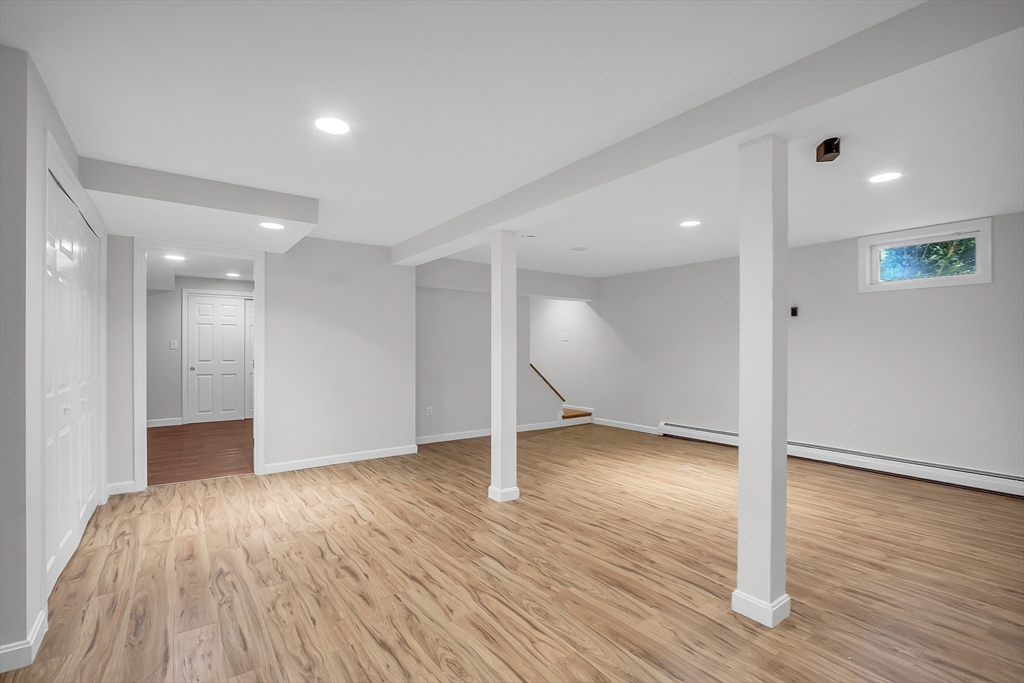 36 Flint Road Acton, MA 01720 - Photo 31 of 37 a view of an empty room and wooden floor